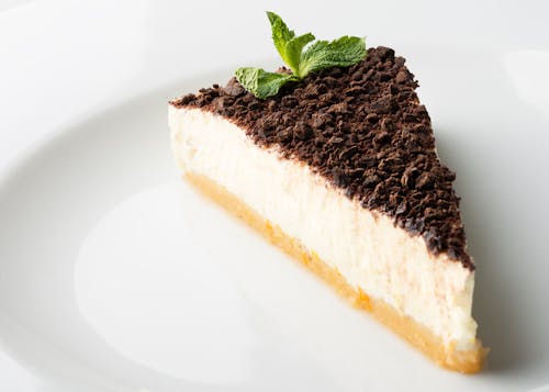 Free Sliced Chocolate Cheesecake on White Ceramic Plate Stock Photo