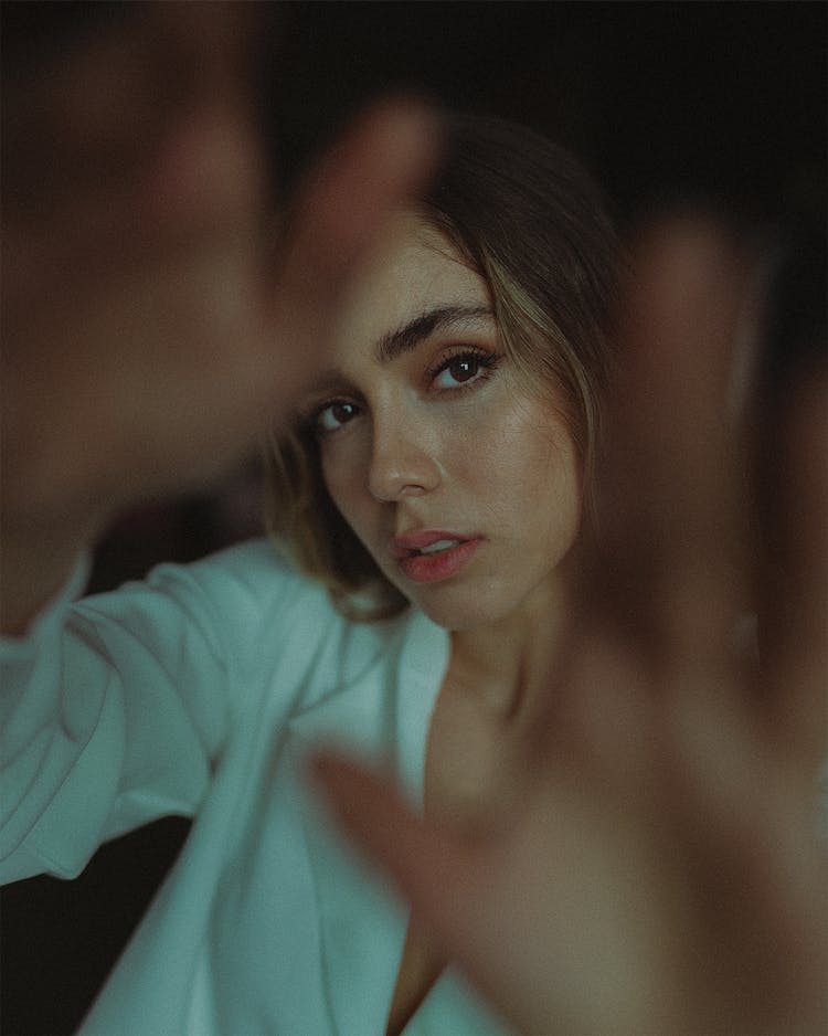 Portrait Of Woman Reaching Her Hands Towards Camera