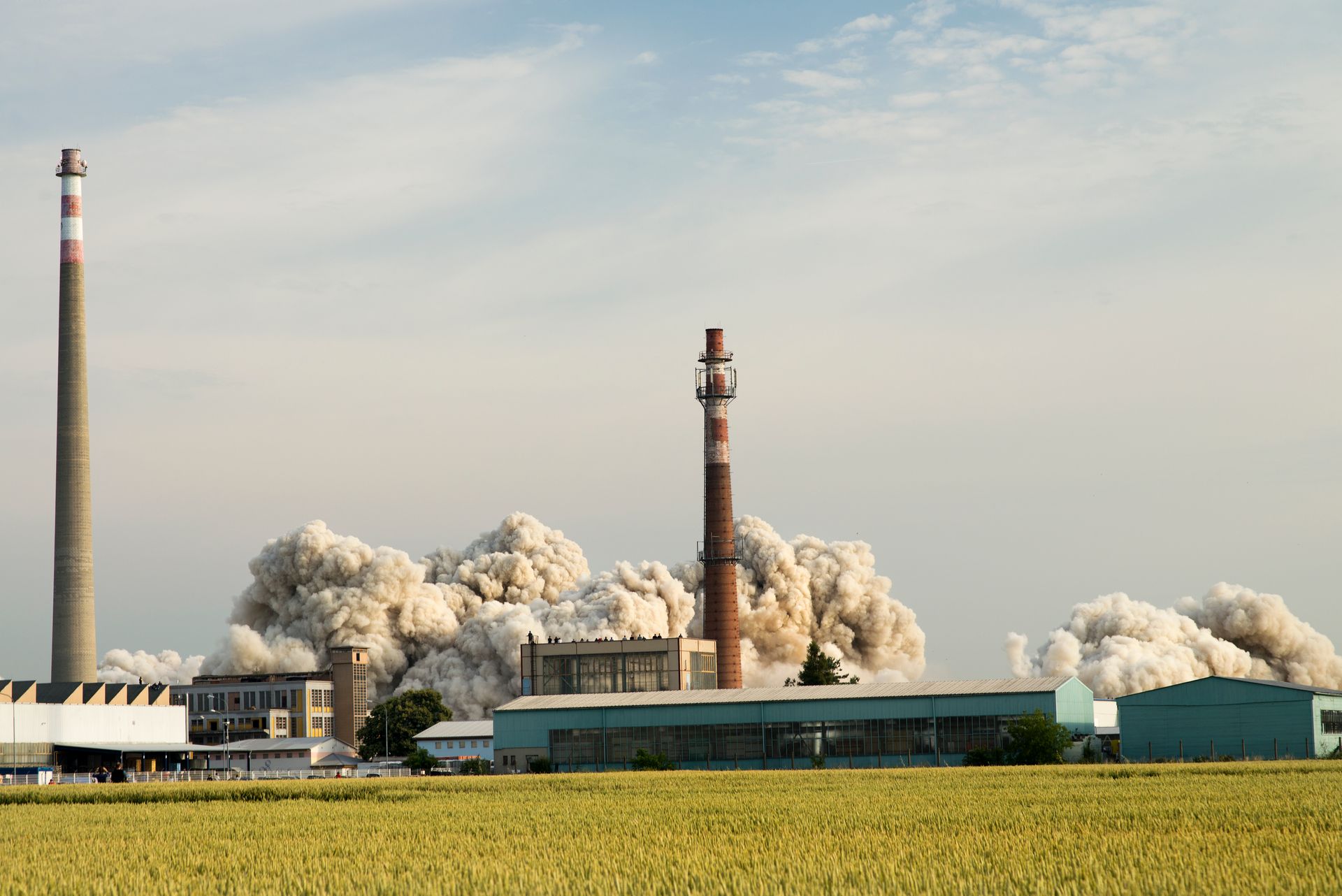 Smoke billows from an industrial factory in Prostějov, Czech Republic, showcasing industrial activity.