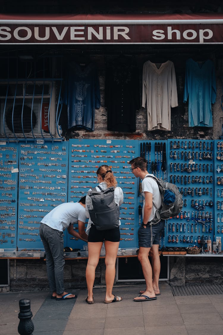 Tourists Buying From A Souvenir Shop