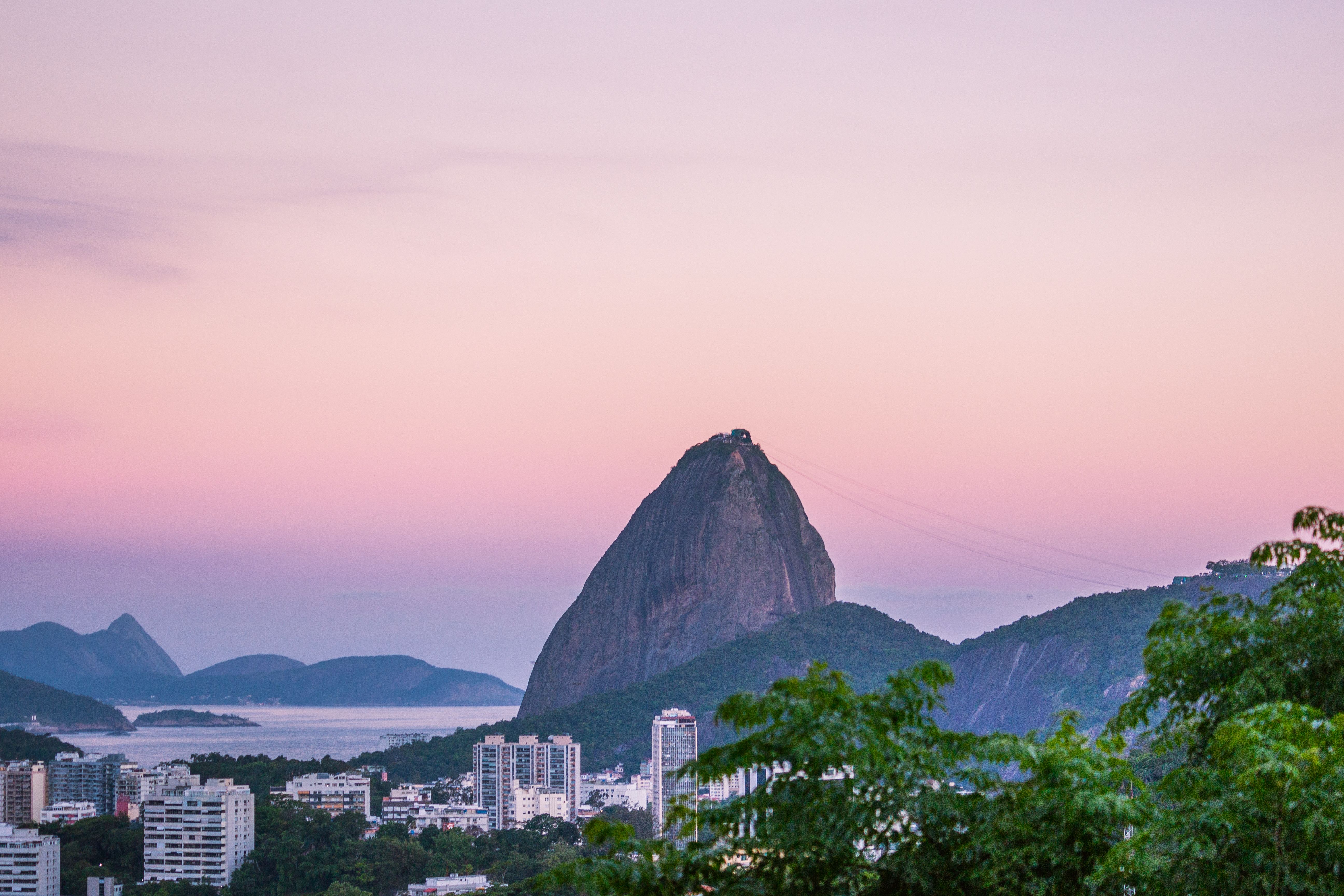 Pão de Açúcar (Sugarloaf Mountain) and the Rio de Janeiro skyline at dusk