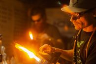 A Man Holding a Blow Torch