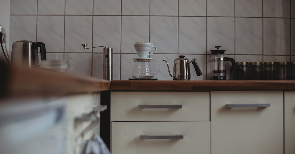 Excess Coffee Mugs In A Cluttered Kitchen Cupboard