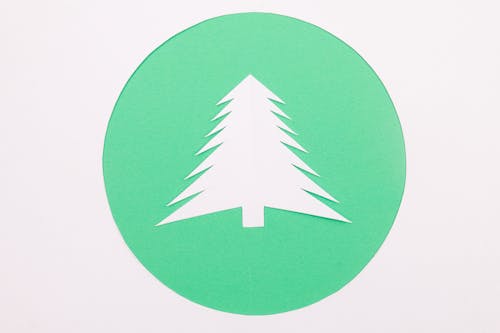 Paper Christmas Tree on Green Background