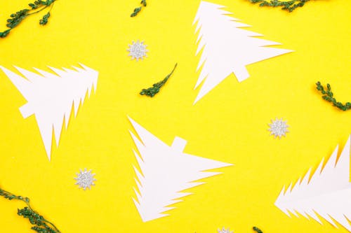 Paper Christmas Trees on Yellow Background