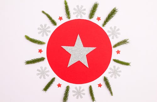 A Star Logo on the Red Circle Surrounded by Stars and Snowflakes