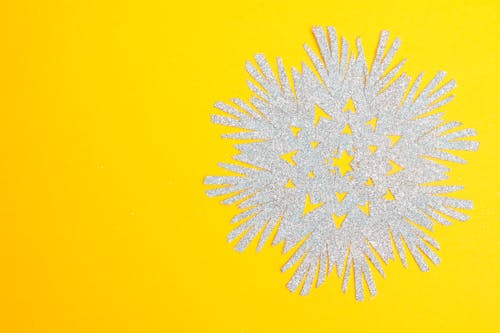 Snowflake Cutout on Yellow Surface