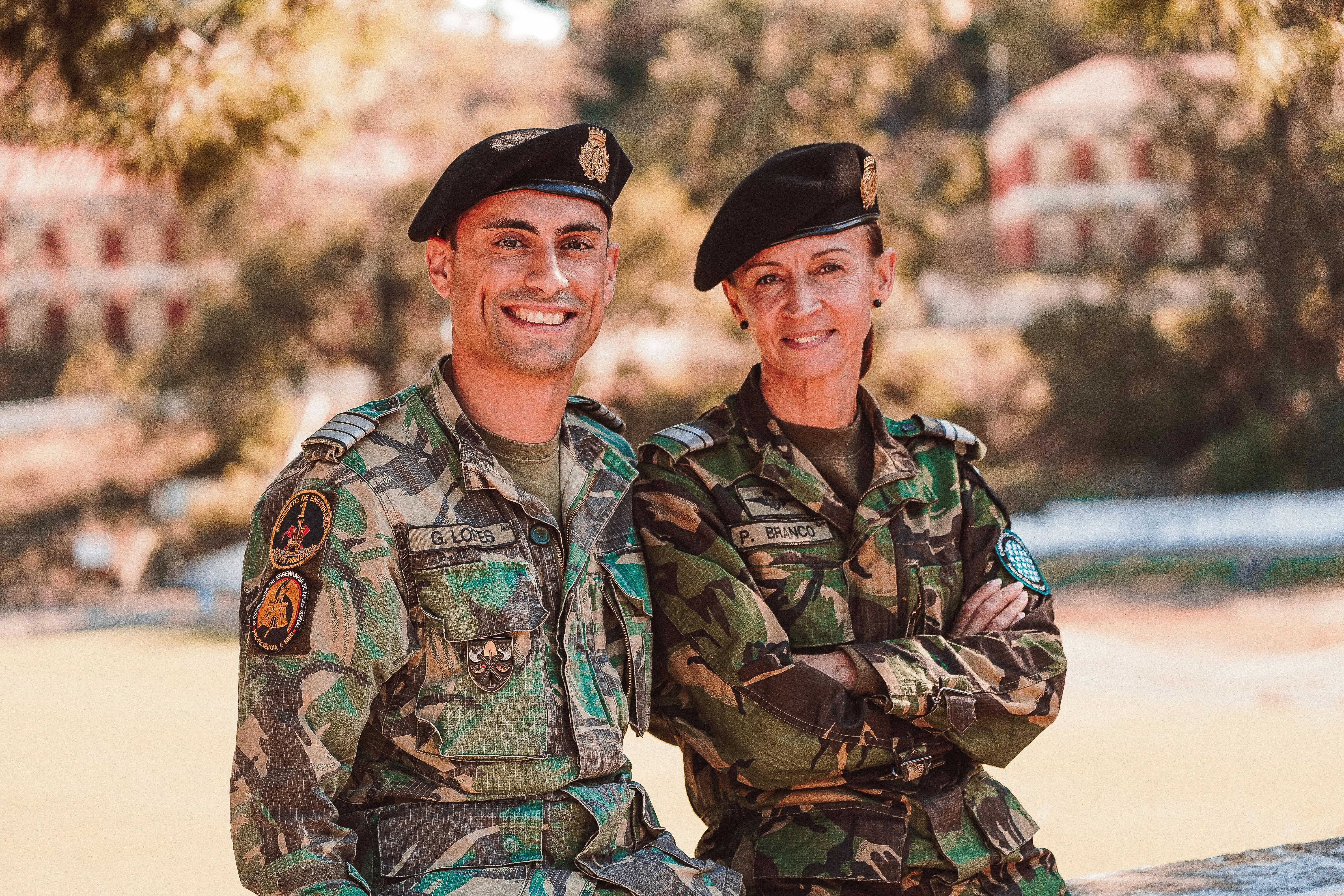 man and woman in camouflage uniform