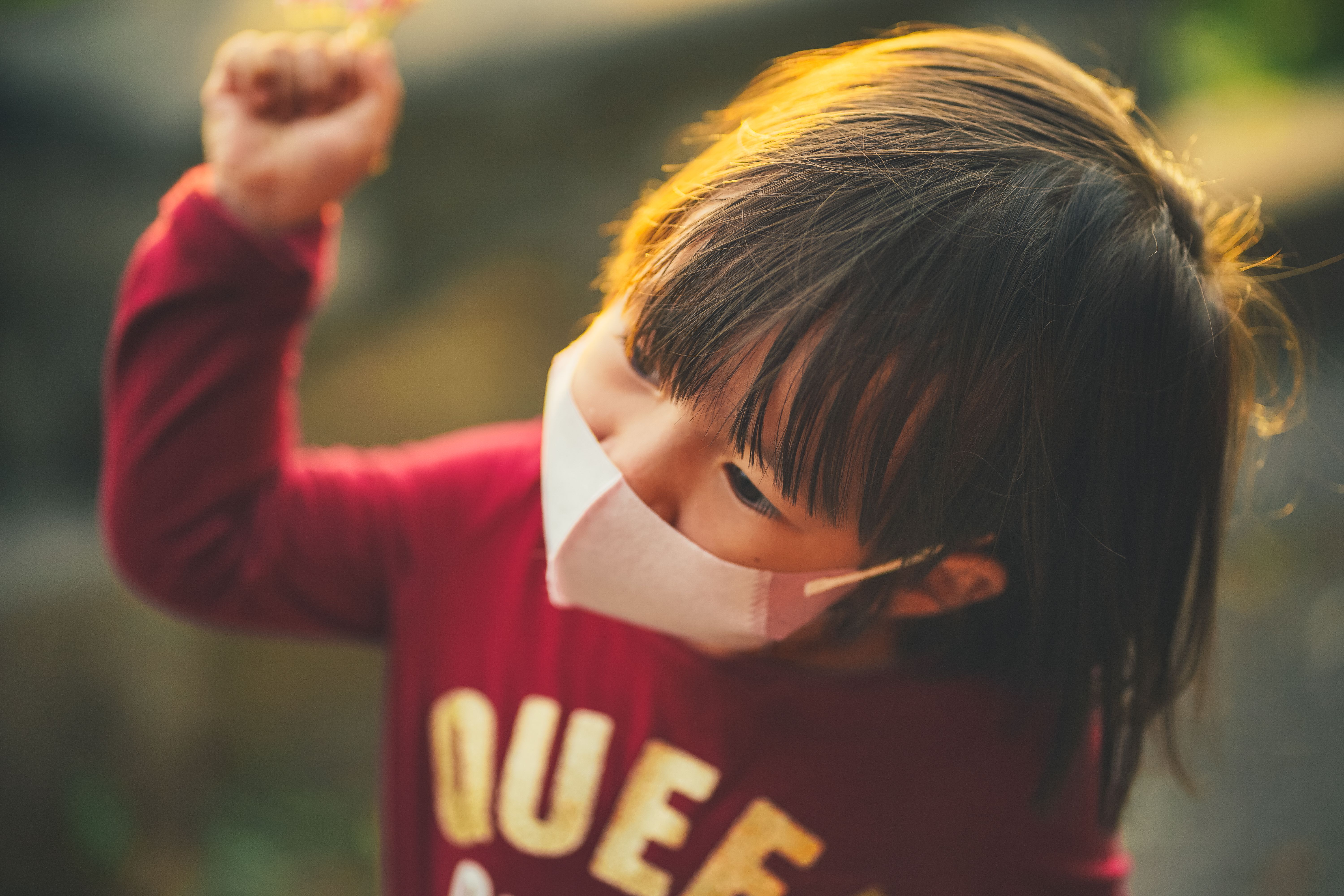 A Cute Little Girl Wearing Face Mask while Looking Afar · Free Stock Photo
