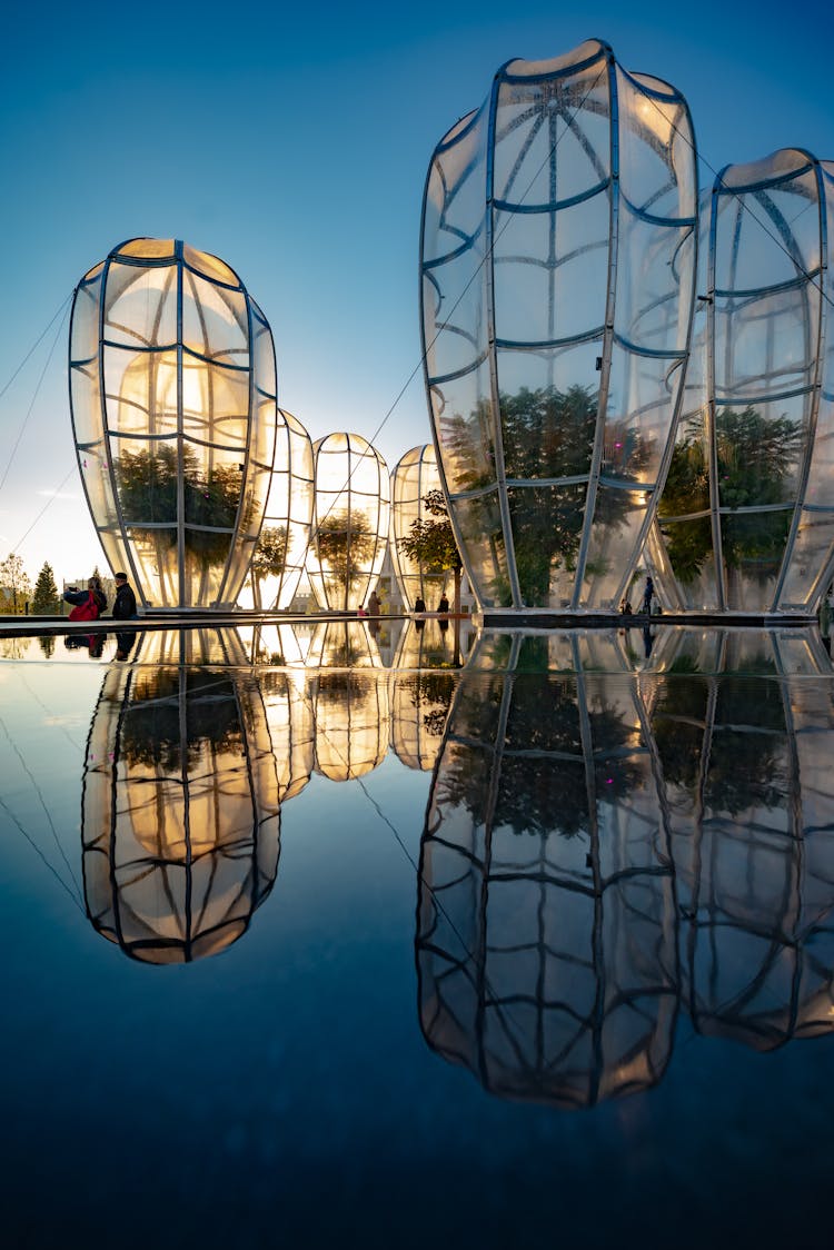 Reflections Of Glass Constructions In Water