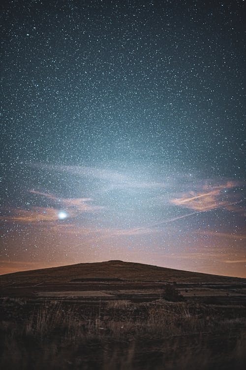 Brown Mountain Under the Starry Sky During Night Time