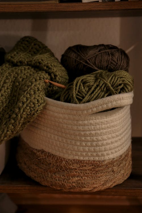 Free Green Yarns in the Handled Textile Basket Stock Photo