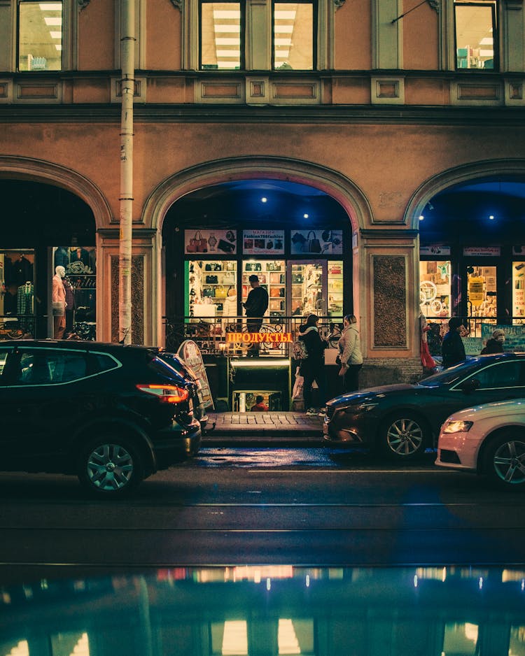 Cars Passing By A Building