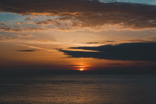 Free Capturing a breathtaking sunset over the Adriatic Sea in Durrës, Albania, with vivid colors. Stock Photo