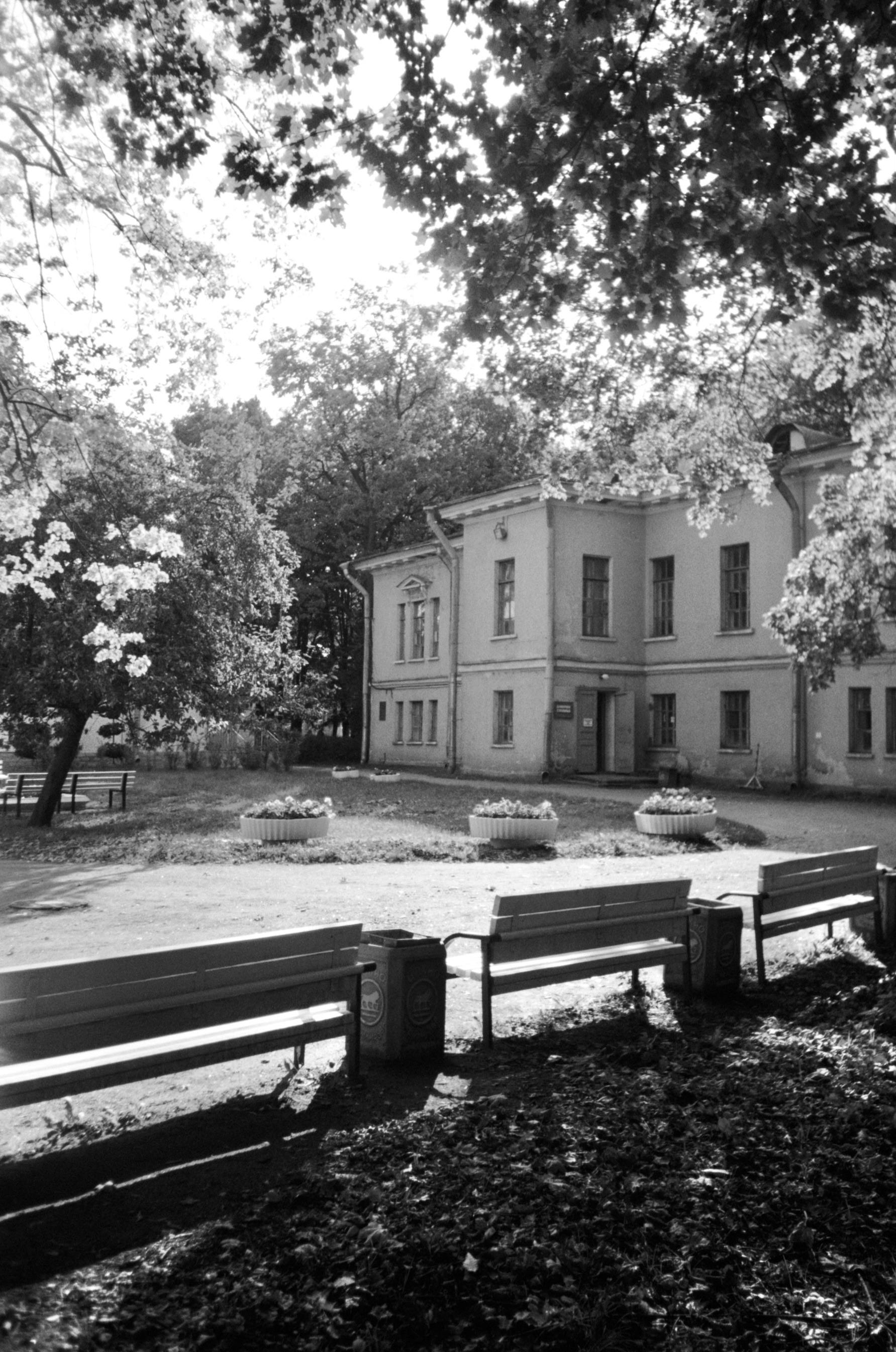 Black and white photo of a historic building surrounded by trees in Saint Petersburg