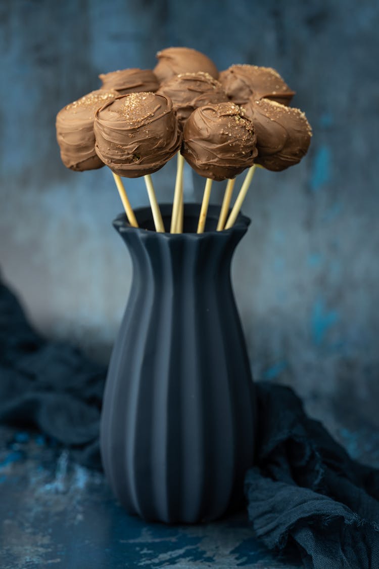 Chocolate Lollipops On Ceramic Vase