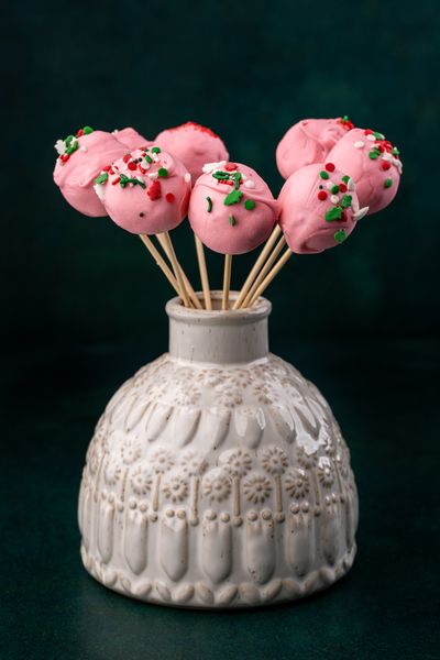 Pink cake pops covered in colorful sprinkles — photo by Skyler Ewing on Pexels