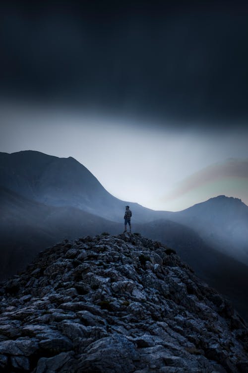 A Person Standing on Rocky Mountain