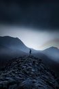 Person Standing on Rock Mountain