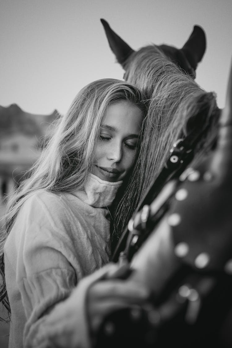 Woman Hugging Horse