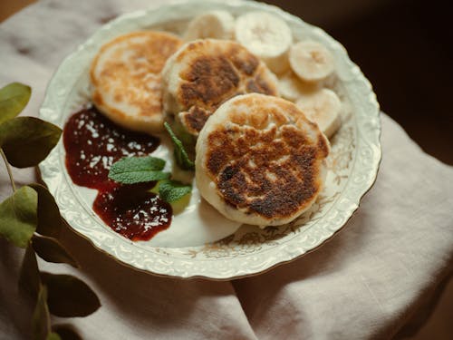 Plate with Pancakes, Jam, Yogurt and Banana