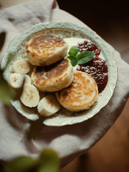 Pancakes with Banana and Jam on Plat