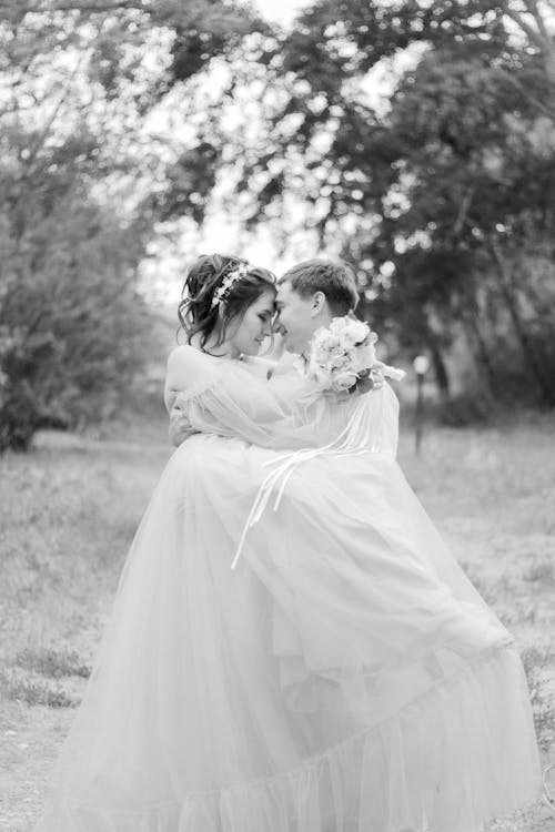 Black and White Portrait of Hugging Bride and Groom