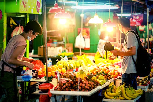 Street Vendors of Fruits in Night Market