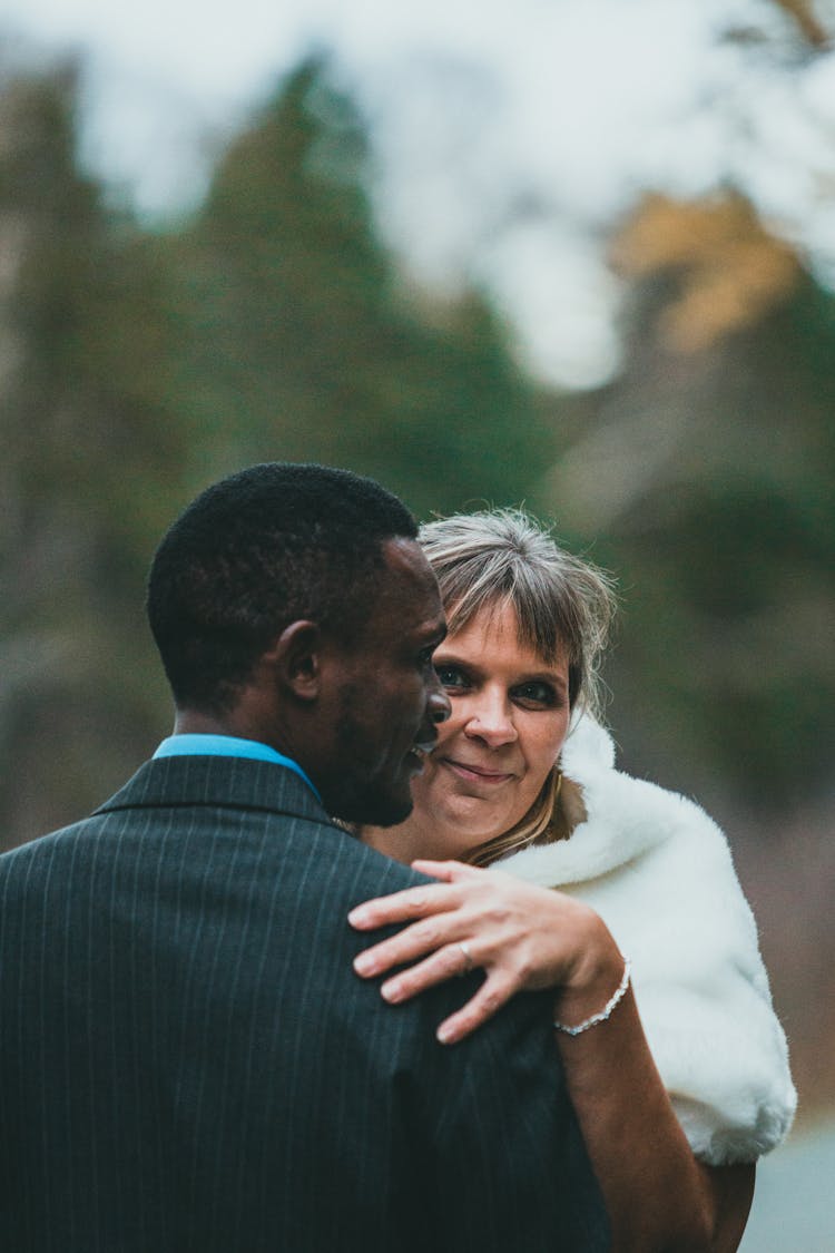 Bride Touching Bridegrooms Shoulder