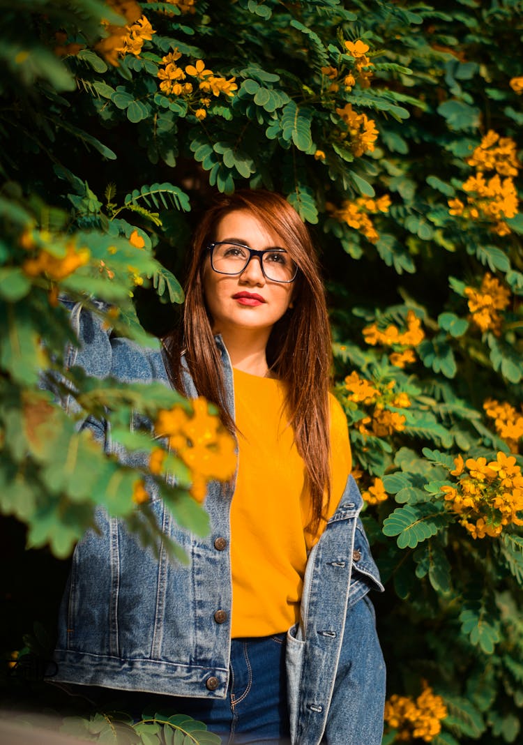 Brunette Woman Below A Tree In Bloom 