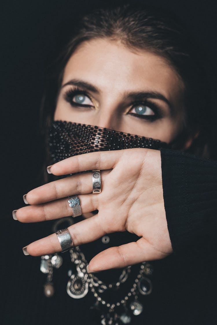 Close-Up Shot Of A Woman Wearing Her Black Facemask