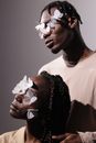 Man in White Crew Neck Shirt With White Smoke on His Mouth