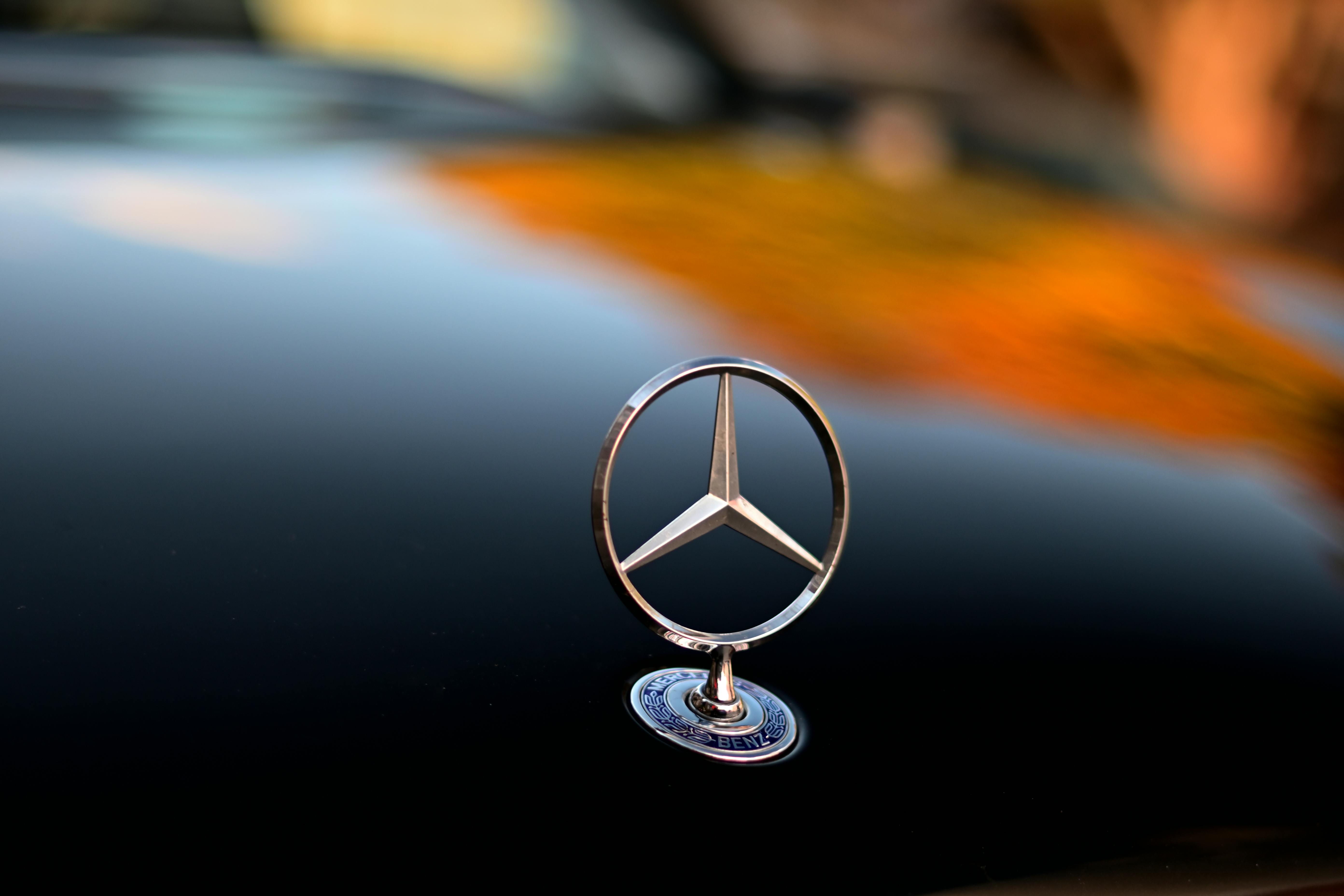 Silver Mercedes Benz Emblem in Close Up Photography · Free Stock Photo