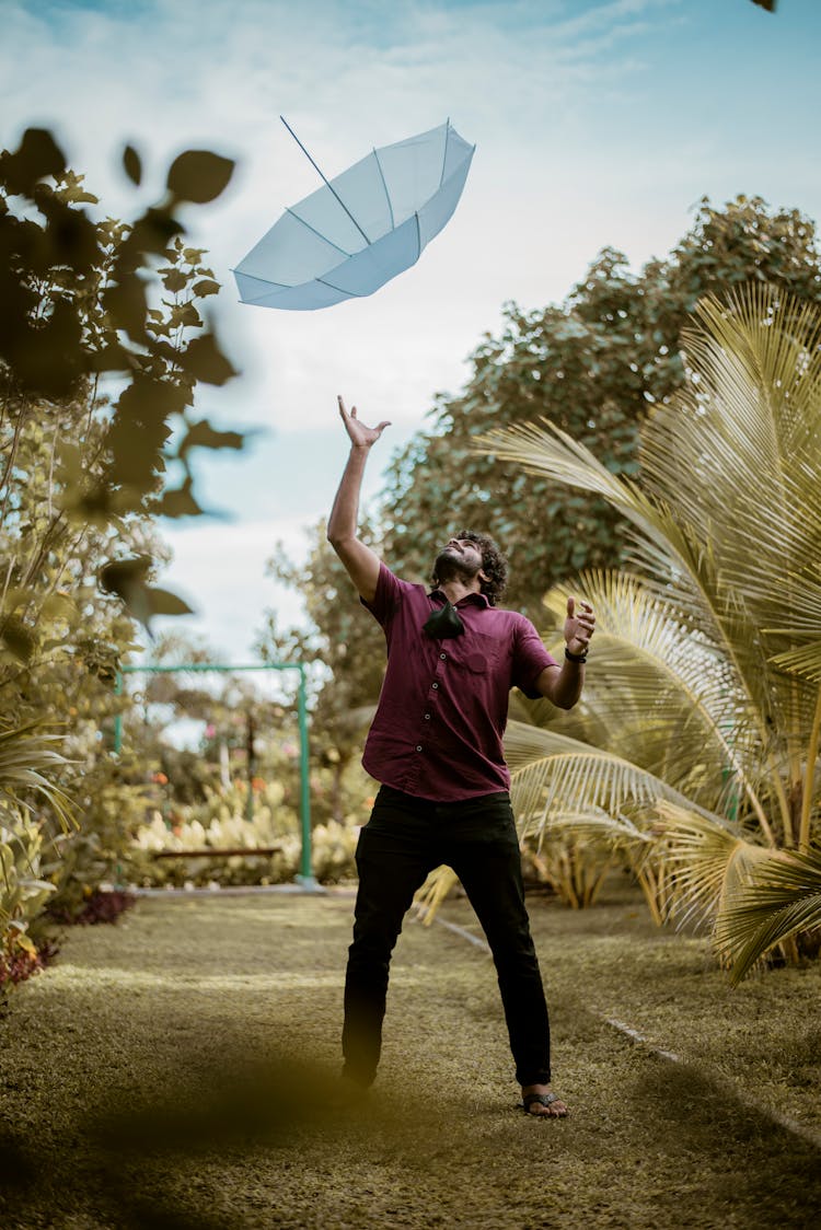 A Man Catching An Umbrella