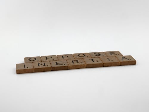 Scrabble Pieces on White Surface