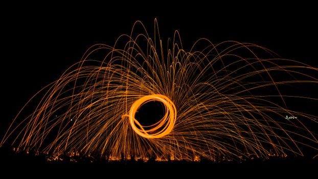 Captivating steel wool photography creating dynamic sparks against a night backdrop.