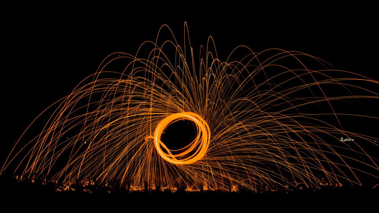 captivating steel wool photography creating dynamic sparks against a n