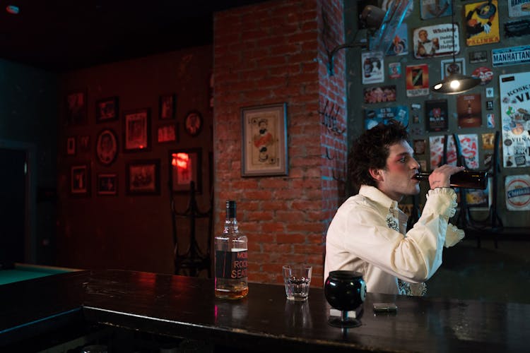 A Man Drinking Beer In The Bar