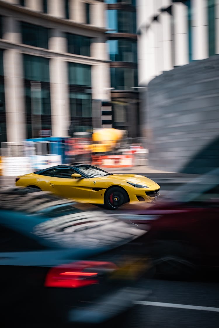 A Yellow Ferrari On The Road