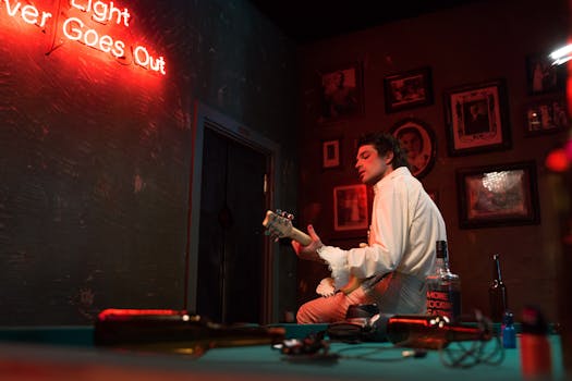 A musician plays electric guitar in a bar under neon lights, creating a punk atmosphere.