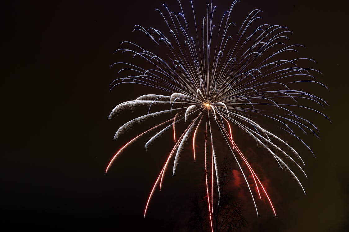 White and Red Fireworks in the Sky