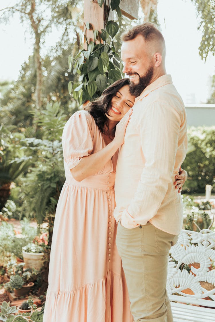 Smiling Woman Hugging Man