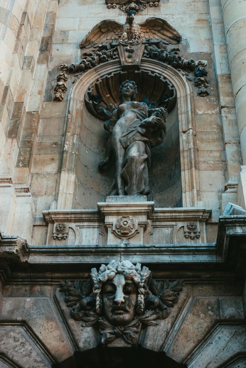 Free Ornate gothic sculpture on a historic building facade, highlighting its intricate design and artistry. Stock Photo