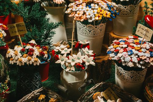 Free Vibrant display of decorative flowers and plants in pots at a market stall. Stock Photo