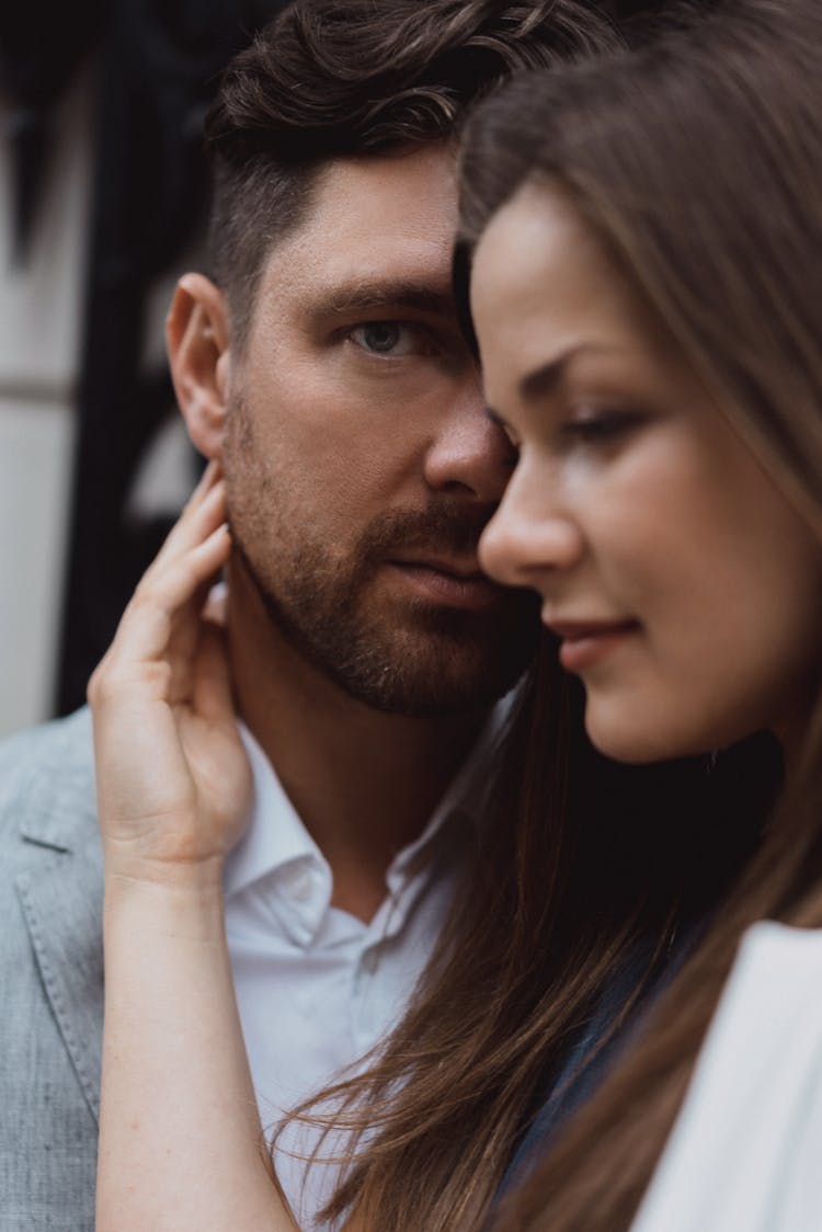 Woman Touching Mans Neck