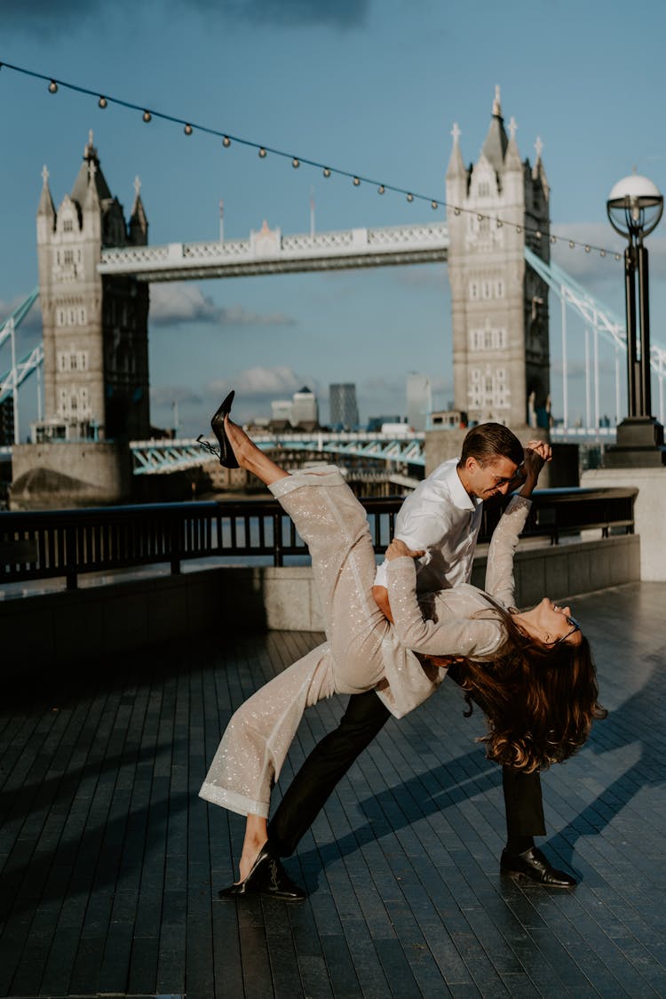 Man And Woman Dancing By Tower Bridge