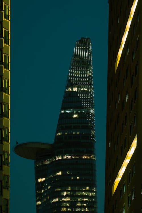 Night Photo of Skyscraper with Heliport on Top 