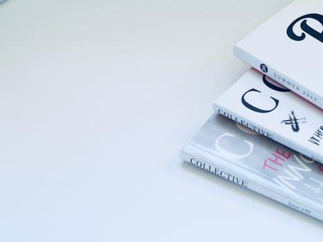 Stack of minimalist designed books on a clean white surface, perfect for creative concepts.
