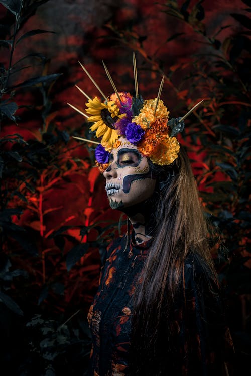Free A Woman Wearing a Halloween Skull Makeup with Flower Headdress
 Stock Photo