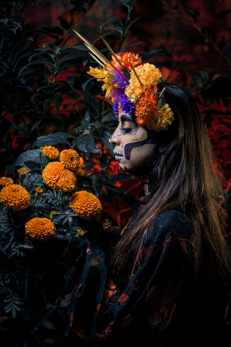 Woman With Flowers For Day Of Dead In Mexico